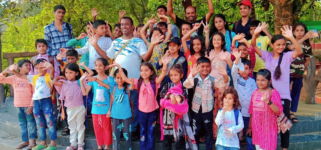 Children waving at the center